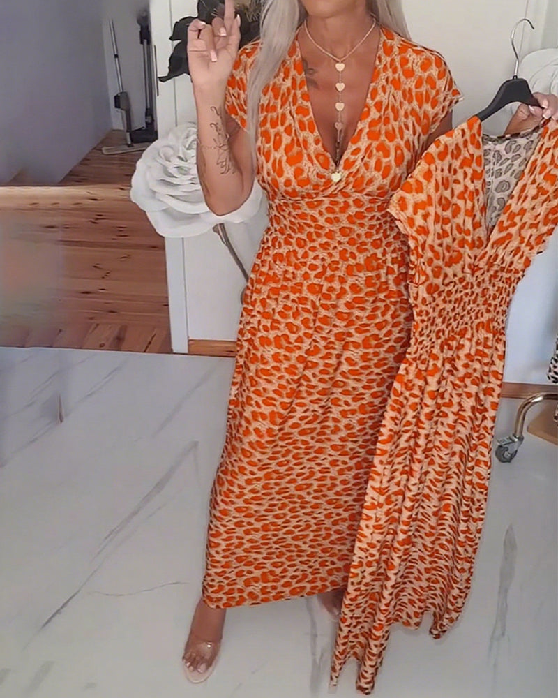 Elegante jurk met luipaardprint en v-hals