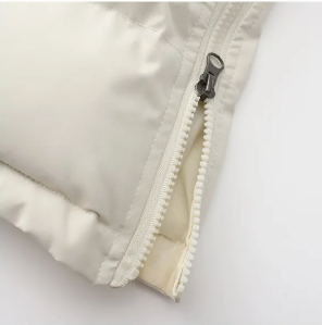 Lange gewatteerde gilet - stijlvolle mouwloze jas voor dames