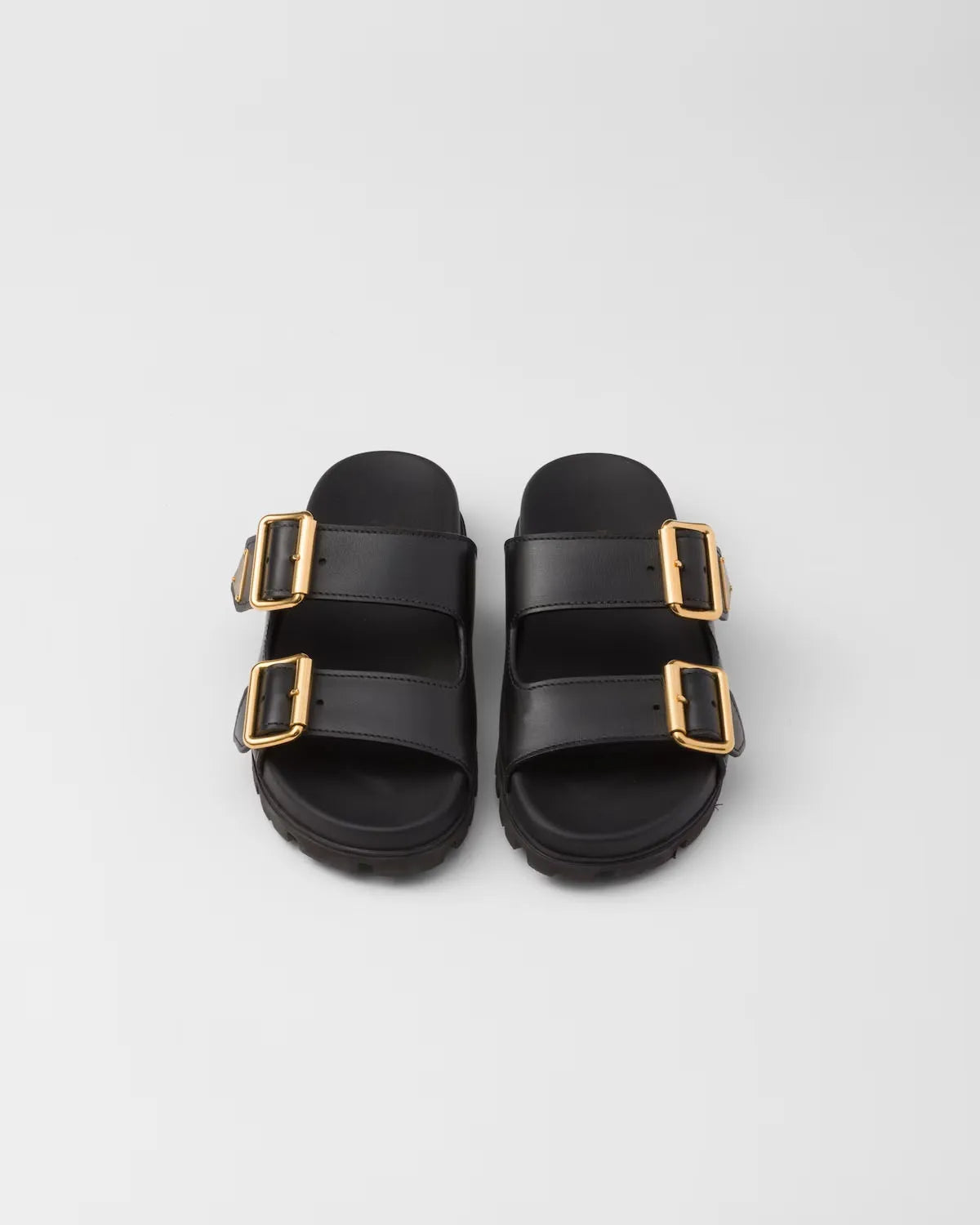 Zwarte slide sandalen met gouden gespen