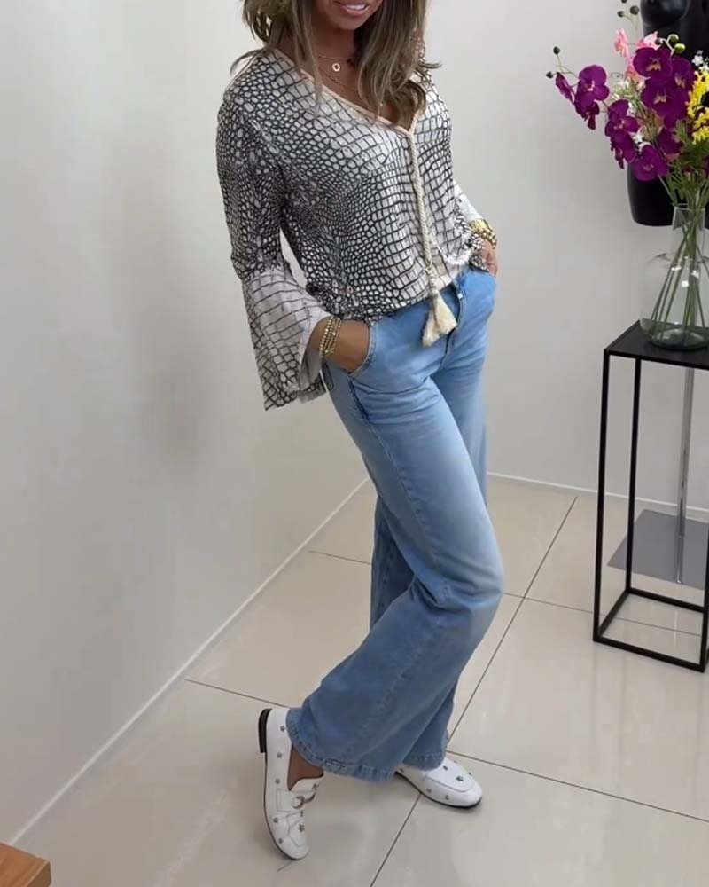 Blouse met bloemmotief en koord