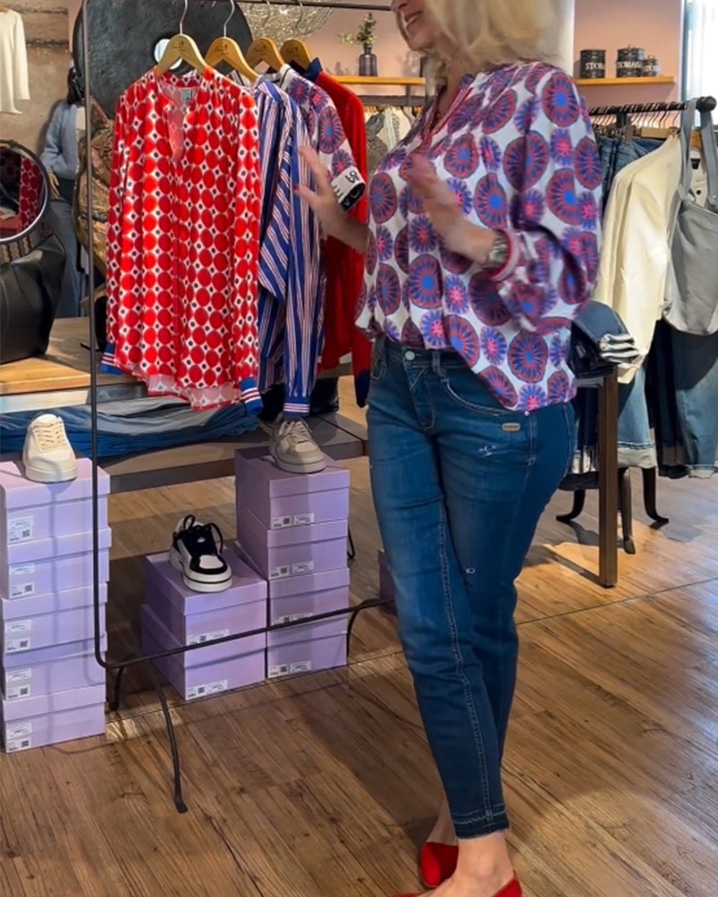 Elegante blouse met V-hals en geometrische print