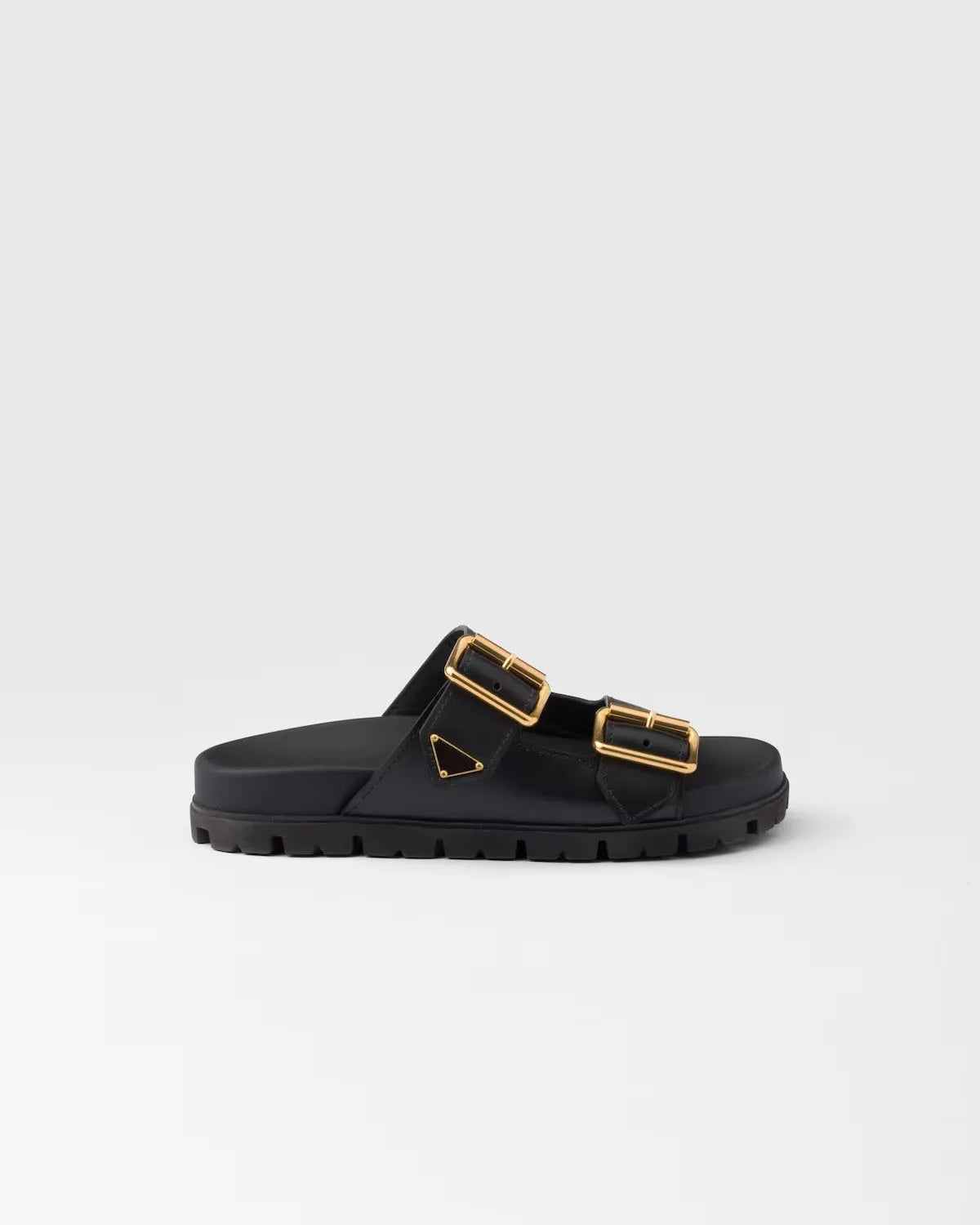 Zwarte slide sandalen met gouden gespen