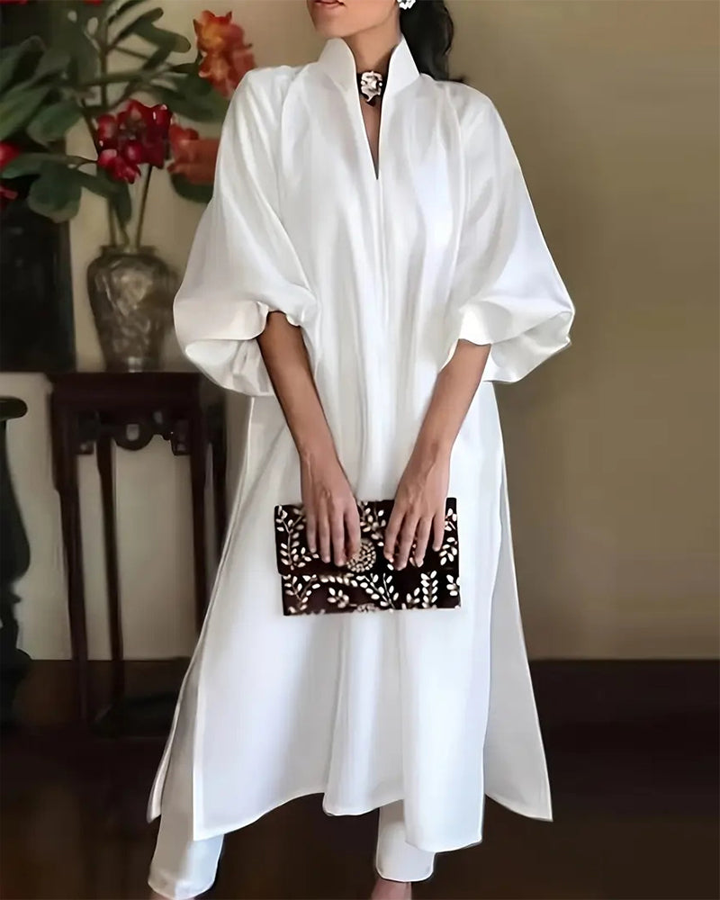 Elegante effen jurk met V-hals en split