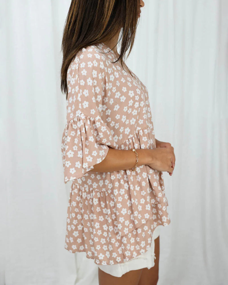 Bloemenblouse met V-hals en klokmouwen