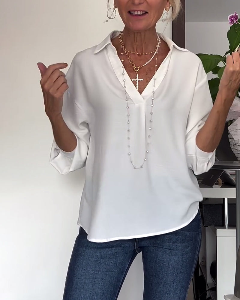 Eenvoudig topje met revers en lange mouwen in effen kleur